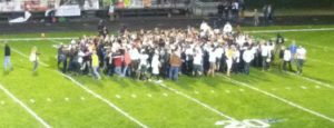 Reeths-Puffer fans storm the field after their team defeated Mona Shores 32-28 Friday night. Photo/Mark Lewis