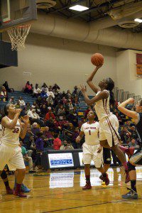 Mardreika Cook scores two of her 25 points for Muskegon. Photo/Jason Goorman