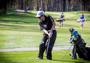 Reeths-Puffer's Collin Colby takes a chip shot during action last week at the Mona Shores Invitational. Colby was tied for seventh overall at Thursday's District 2-13 tournament. Photo/Tim Reilly