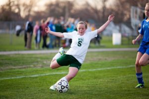 Brianna Garceau winds up to kick the ball for WMC. Photo/Randy Riksen