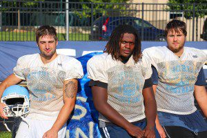 Mona Shores defensive standouts, from left, Dom Shermeta, Christian Boyd and Mike Bordeaux. Photo/Jason Goorman.