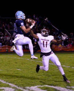 Muskegon’s Jacorey Sullivan (11) breaks up a pass to Hunter Boersma (11) stopping a Mona Shores drive. Photo/Eric Sturr
