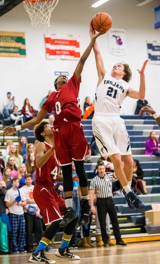 Orchard Views Edriese Jenkins goes up for the rebound against Fruitports Cameron Brandow. Photo/Tim Reilly