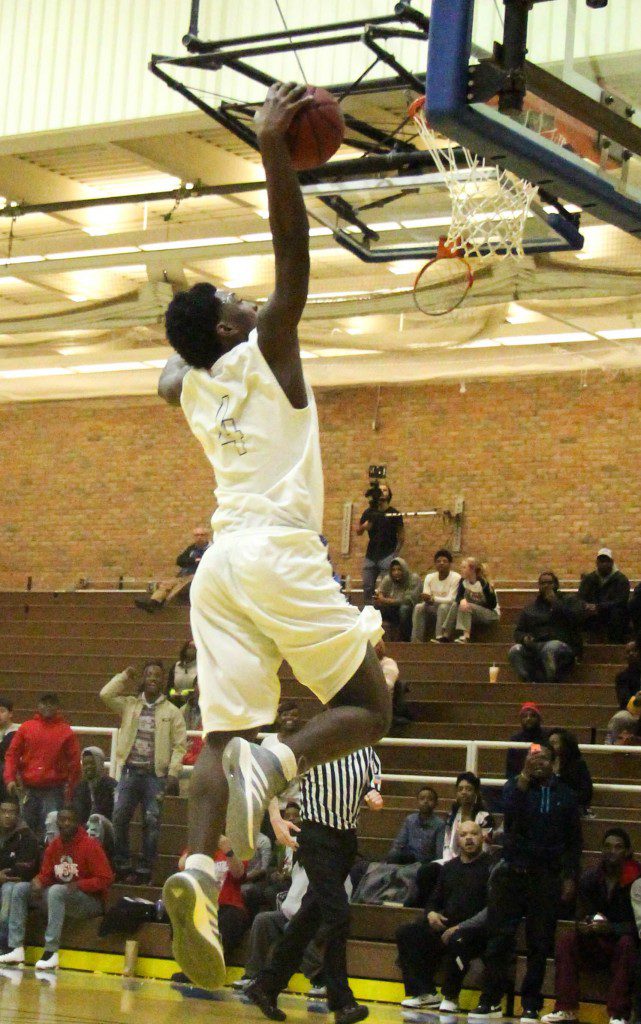 MCC's Marcus Tumblin goes up for the breakaway dunk. Photo/Jason Goorman