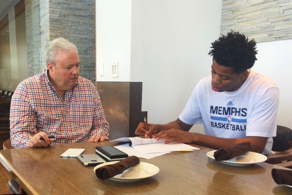 Deyonta Davis signing his contract with Memphis GM Chris Wallace. 