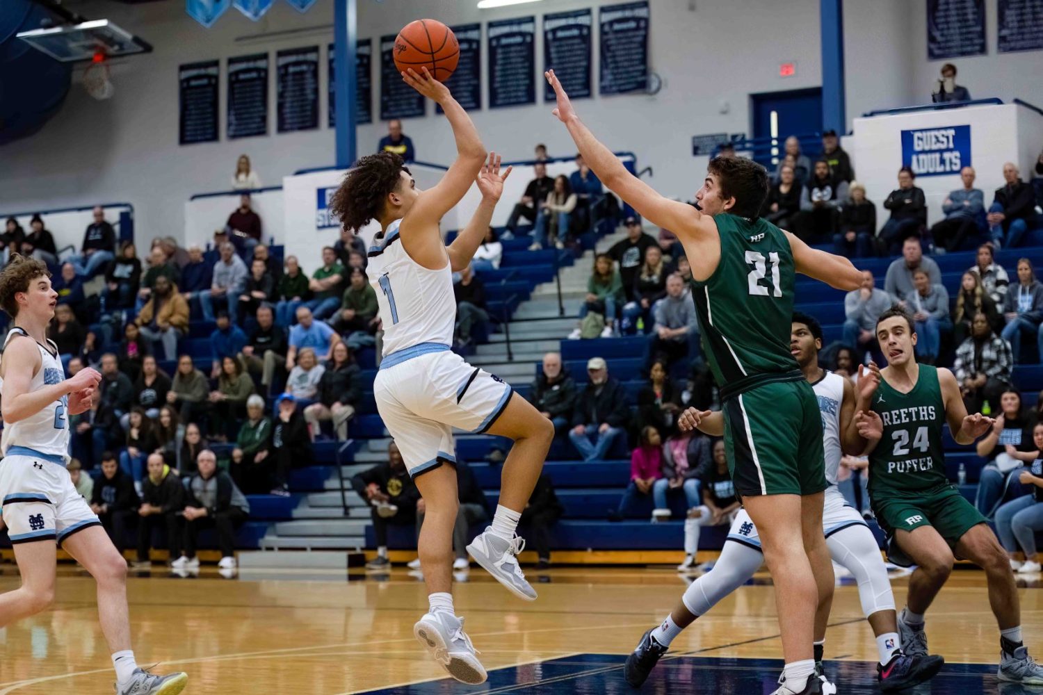 Reeths-Puffer pulls away for a boys basketball victory over rival Mona Shores